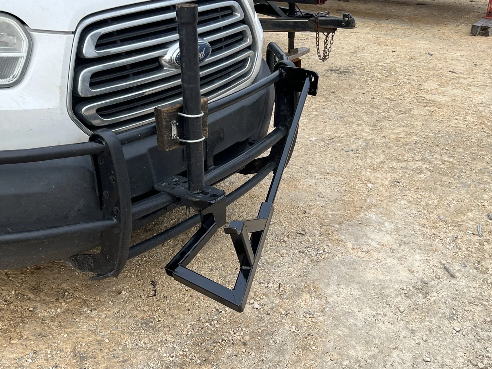 Custom fabricated steel grille guard mounted on a work van