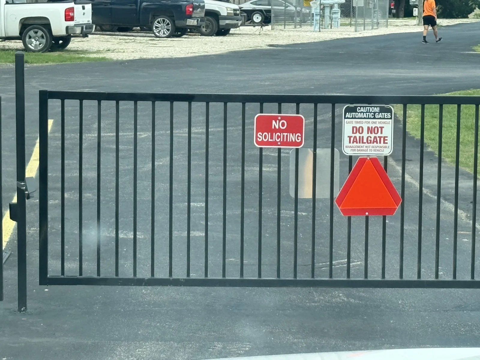 Custom black steel automatic gate fabricated and installed