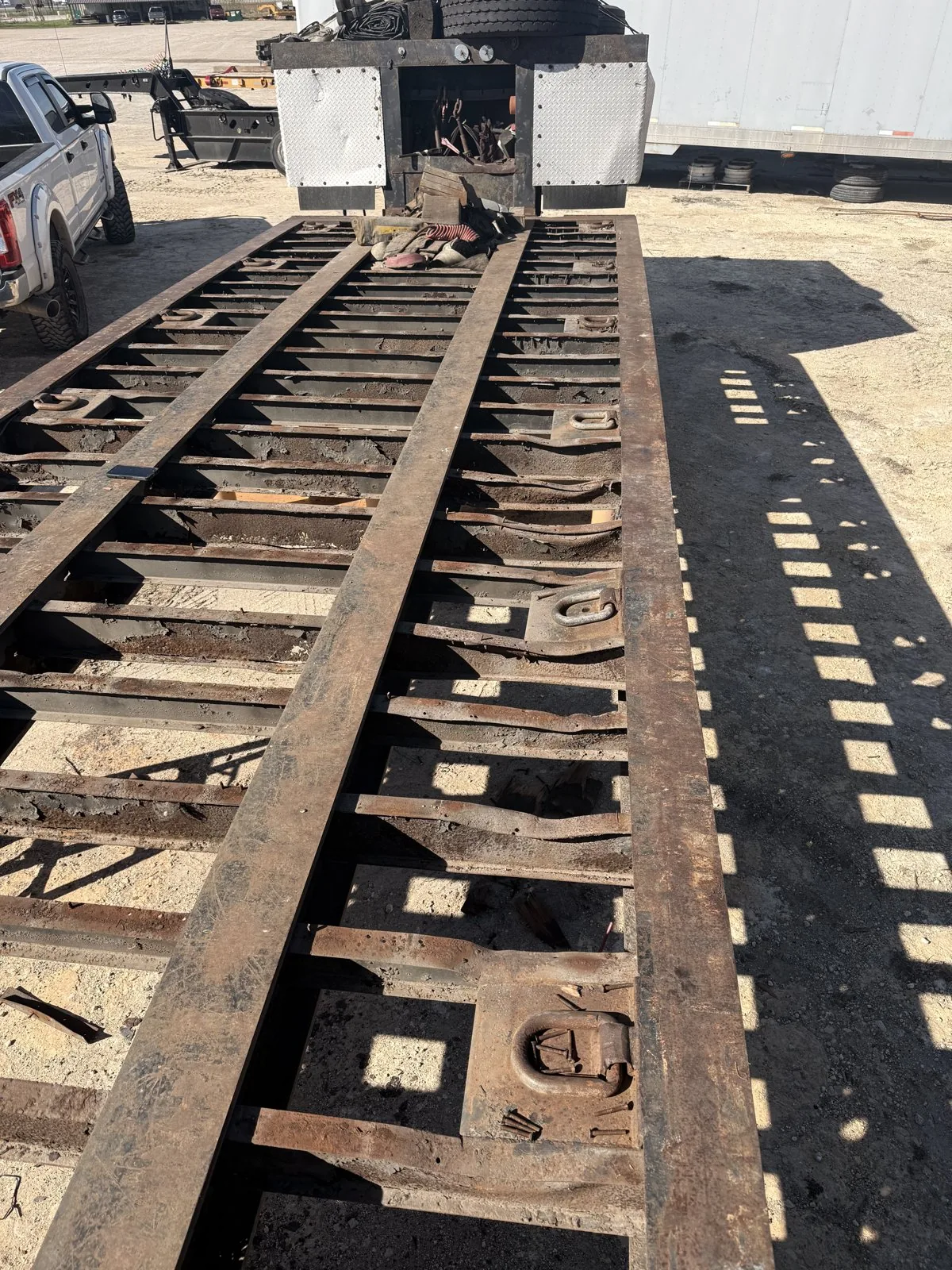 Trailer frame stripped to the crossmembers for structural repair